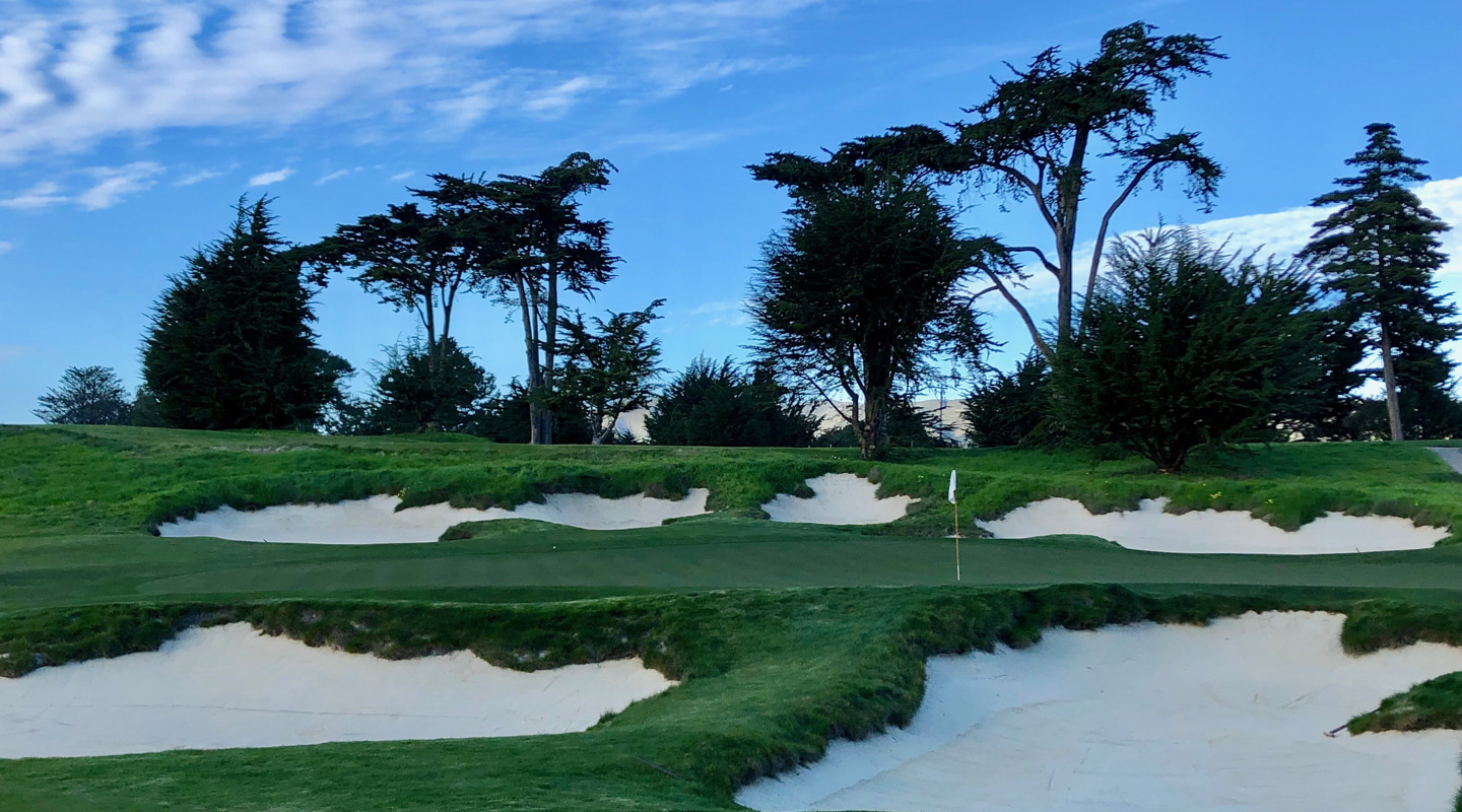 Deep bunkers guard the front right