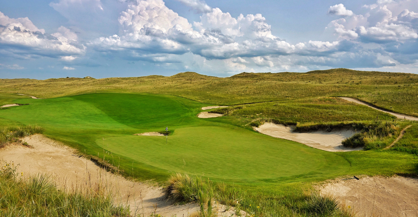 An iconic green wonderfully set amongst the dunes An iconic green wonderfully set amongst the dunes