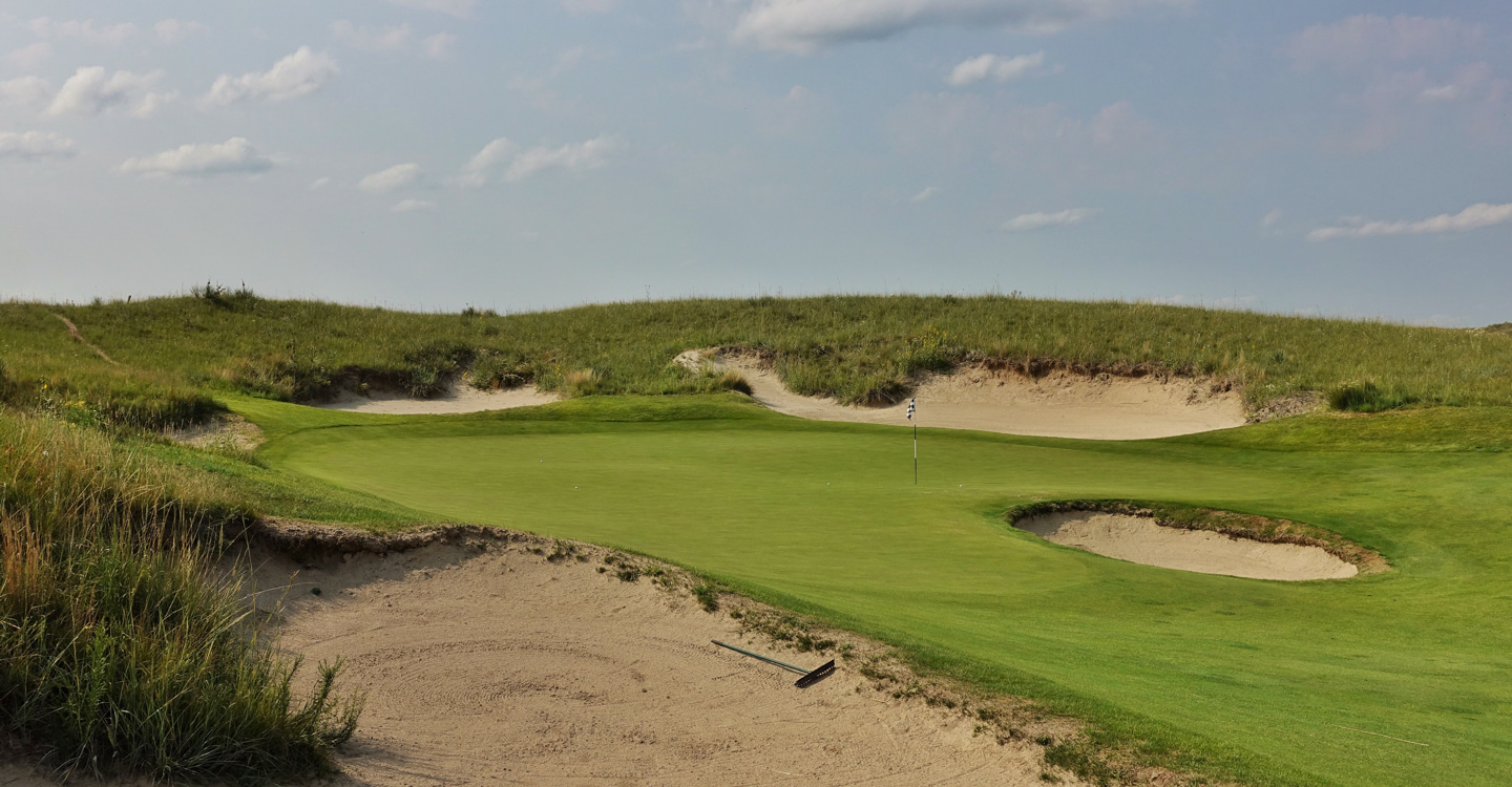 Pins behind the front bunker tempt disaster Pins behind the front bunker tempt disaster