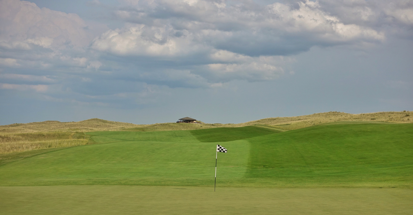 The fairway tumbles into a green which accepts running approaches The fairway tumbles into a green which accepts running approaches